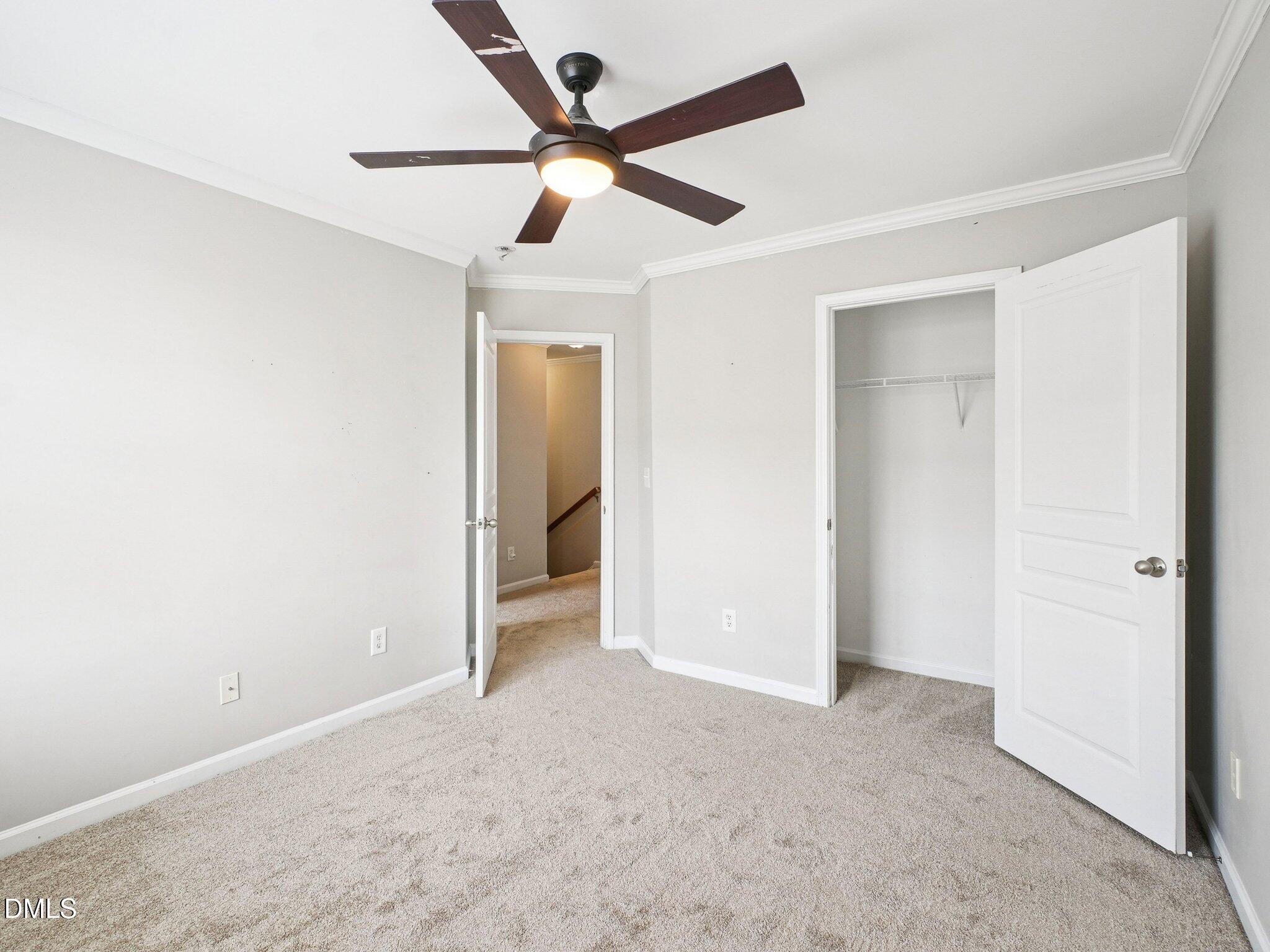 9238 Wooden Road Raleigh, NC 27617 - Photo 37 of 45 an empty room with ceiling fan and a ceiling fan