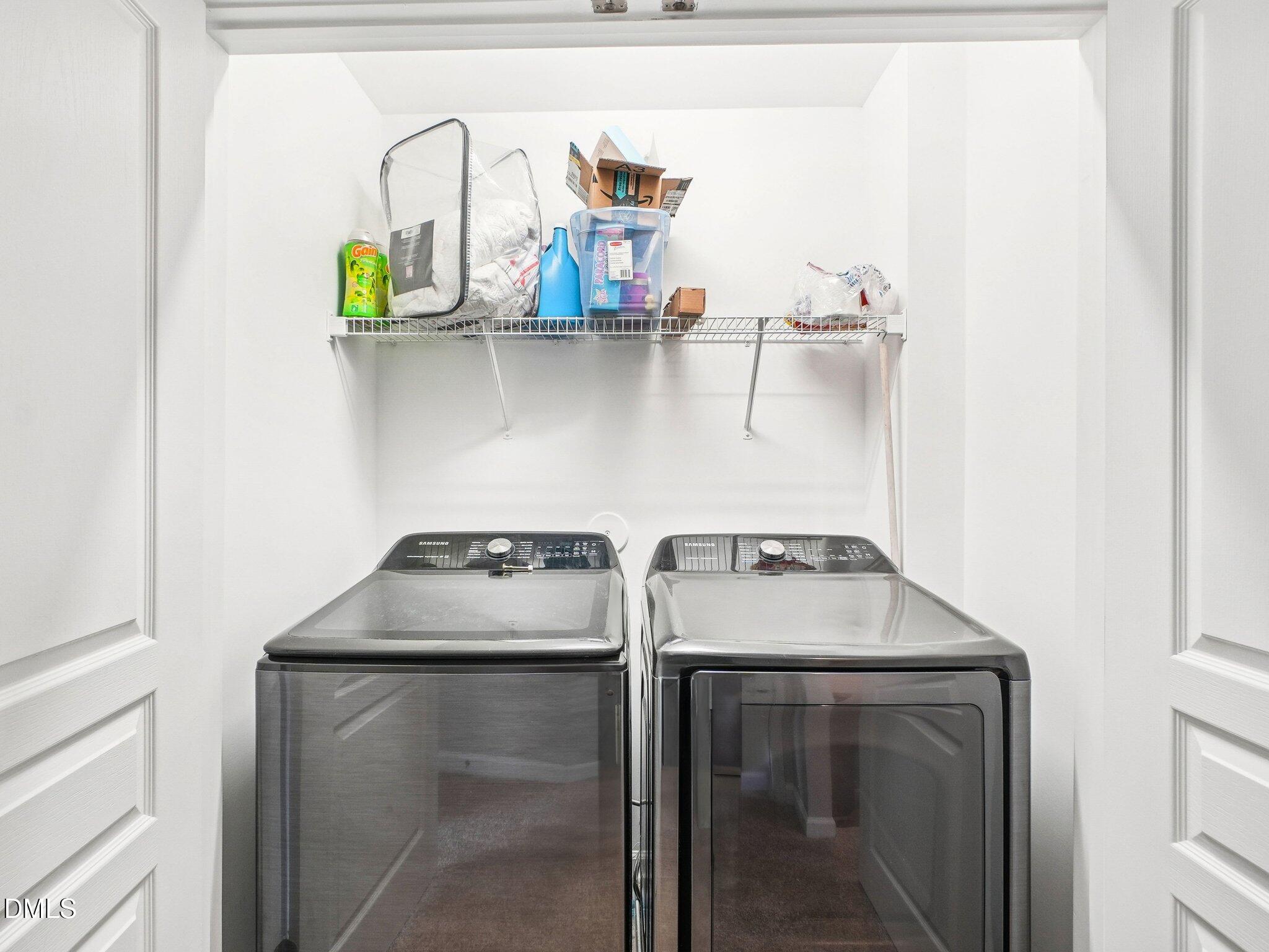 9238 Wooden Road Raleigh, NC 27617 - Photo 39 of 45 a utility room with dryer and washer