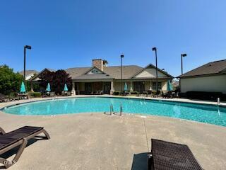 9238 Wooden Road Raleigh, NC 27617 - Photo 44 of 45 a front view of a house with a yard