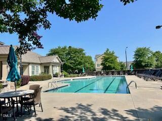 9238 Wooden Road Raleigh, NC 27617 - Photo 45 of 45 a view of a house with a swimming pool
