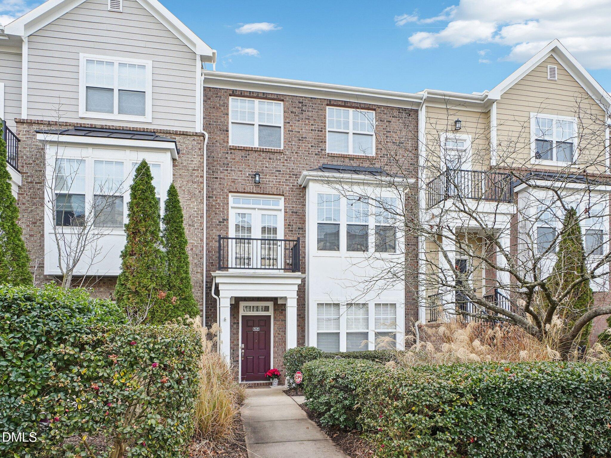 9238 Wooden Road Raleigh, NC 27617 - Photo 5 of 45 front view of a house with a yard