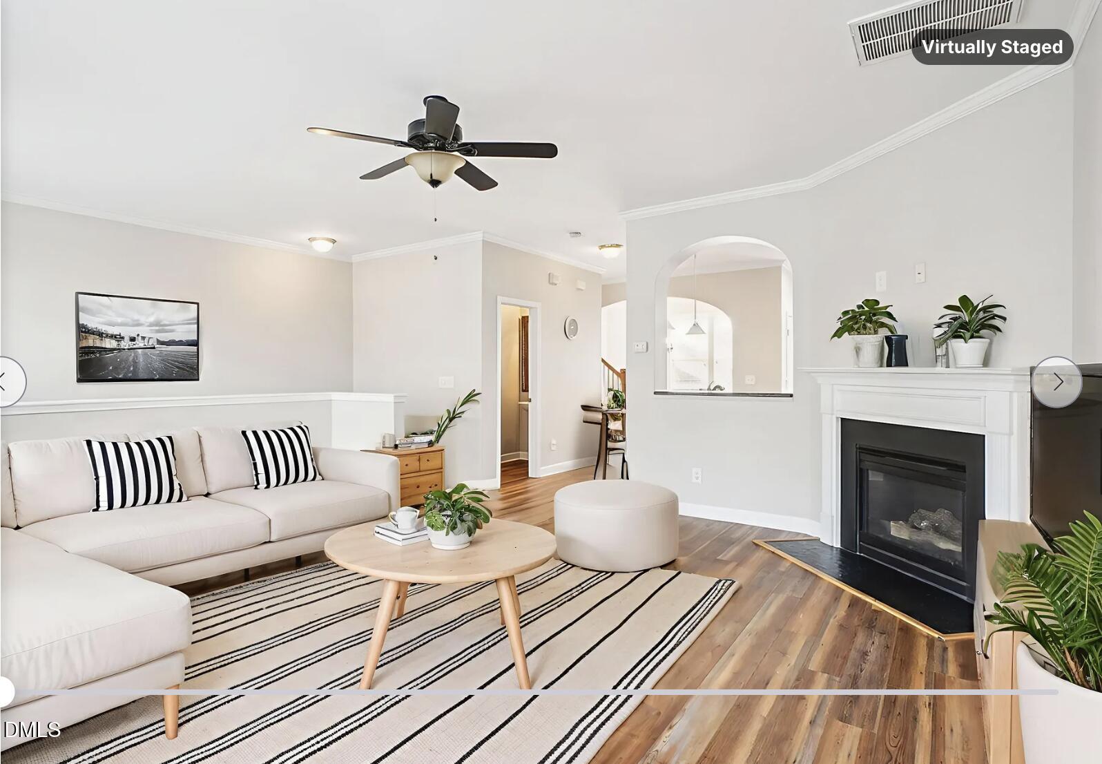 9238 Wooden Road Raleigh, NC 27617 - Photo 10 of 45 a living room with furniture and a fireplace