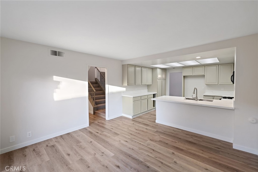 33666 Surfside Drive, Unit 38 Dana Point, CA 92629 - Photo 15 of 39 a view of kitchen with wooden floor and electronic appliances