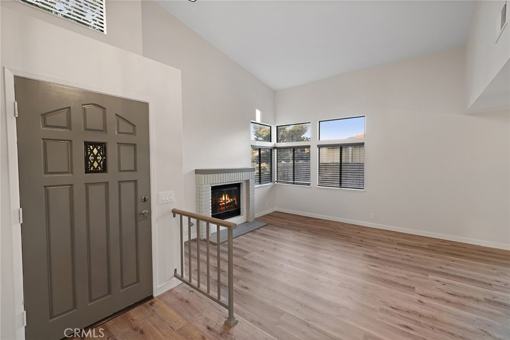 33666 Surfside Drive, Unit 38 Dana Point, CA 92629 - Photo 2 of 39 a view of a livingroom with wooden floor
