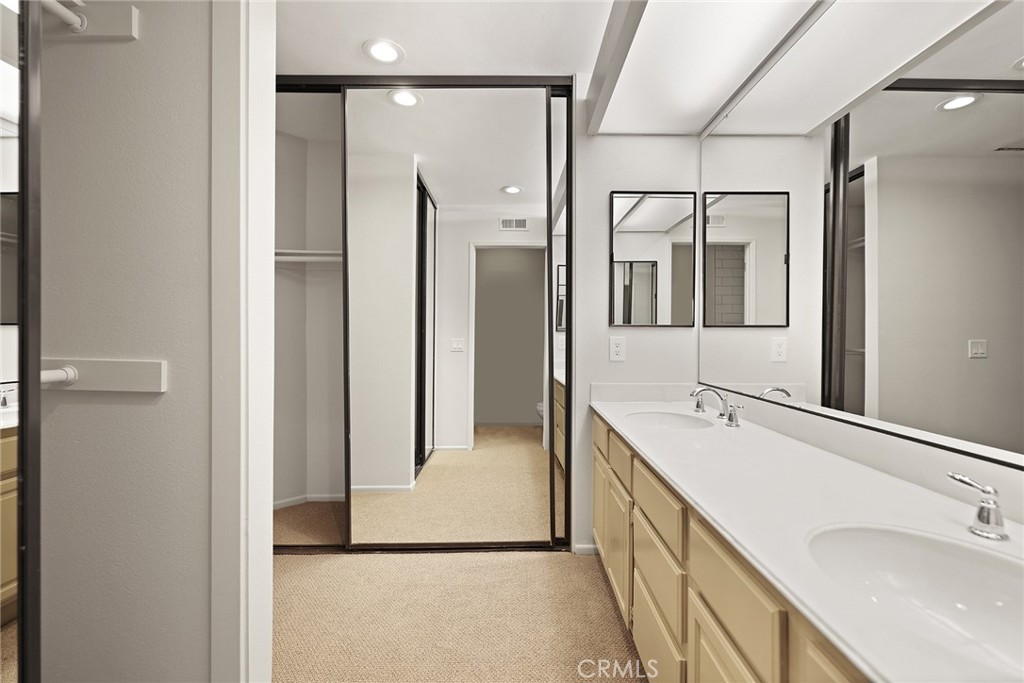 33666 Surfside Drive, Unit 38 Dana Point, CA 92629 - Photo 27 of 39 a bathroom with a double vanity sink mirror and shower