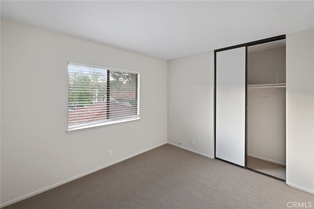 33666 Surfside Drive, Unit 38 Dana Point, CA 92629 - Photo 31 of 39 a view of an empty room with a window