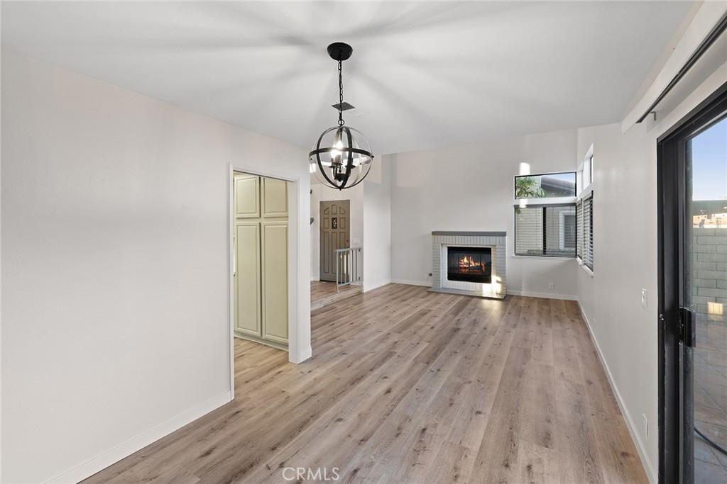 33666 Surfside Drive, Unit 38 Dana Point, CA 92629 - Photo 7 of 39 a view of a livingroom with wooden floor and a ceiling fan