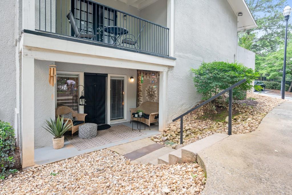 1150 Collier Road Northwest, Unit K26 Atlanta, GA 30318 - Photo 1 of 1 a house view with a outdoor space