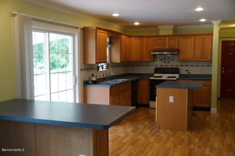 708 Clayton Road Sheffield, MA 01222 - Photo 2 of 19 a kitchen with stainless steel appliances granite countertop a stove a sink a refrigerator and a microwave