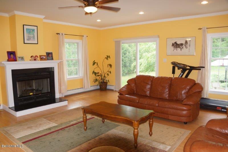 708 Clayton Road Sheffield, MA 01222 - Photo 3 of 19 a living room with furniture and a fireplace