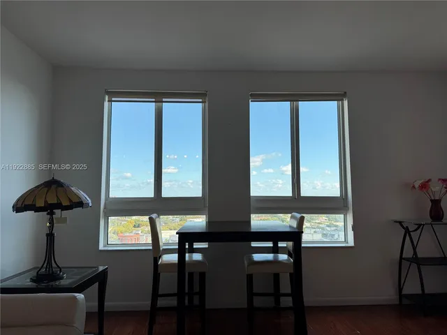 a view of a livingroom with furniture and window