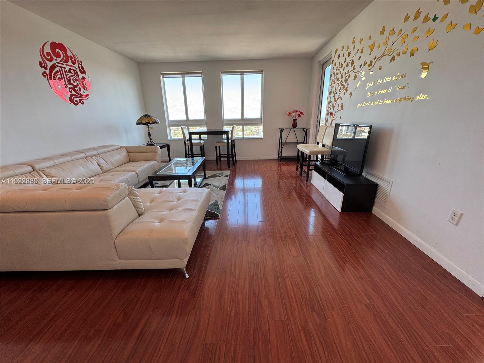 7350 Southwest 89th Street, Unit 1801S Miami, FL 33156 - Photo 4 of 15 a living room with furniture and wooden floor