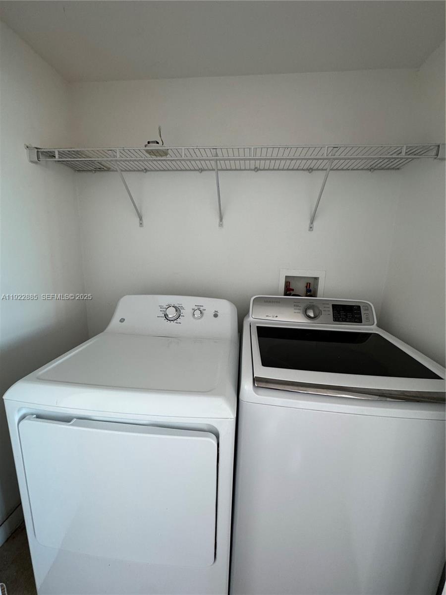 7350 Southwest 89th Street, Unit 1801S Miami, FL 33156 - Photo 5 of 15 a utility room with dryer and washer