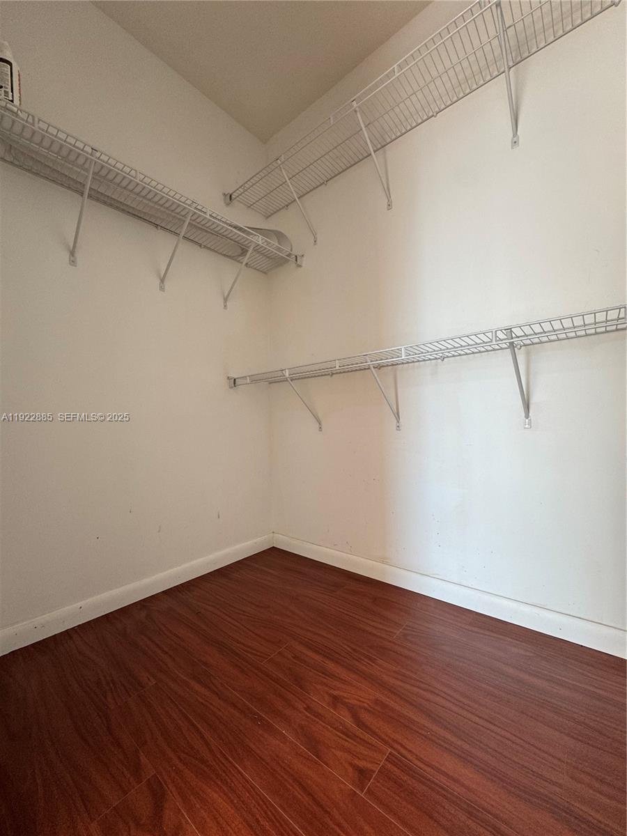 7350 Southwest 89th Street, Unit 1801S Miami, FL 33156 - Photo 6 of 15 a view of a room with wooden floor
