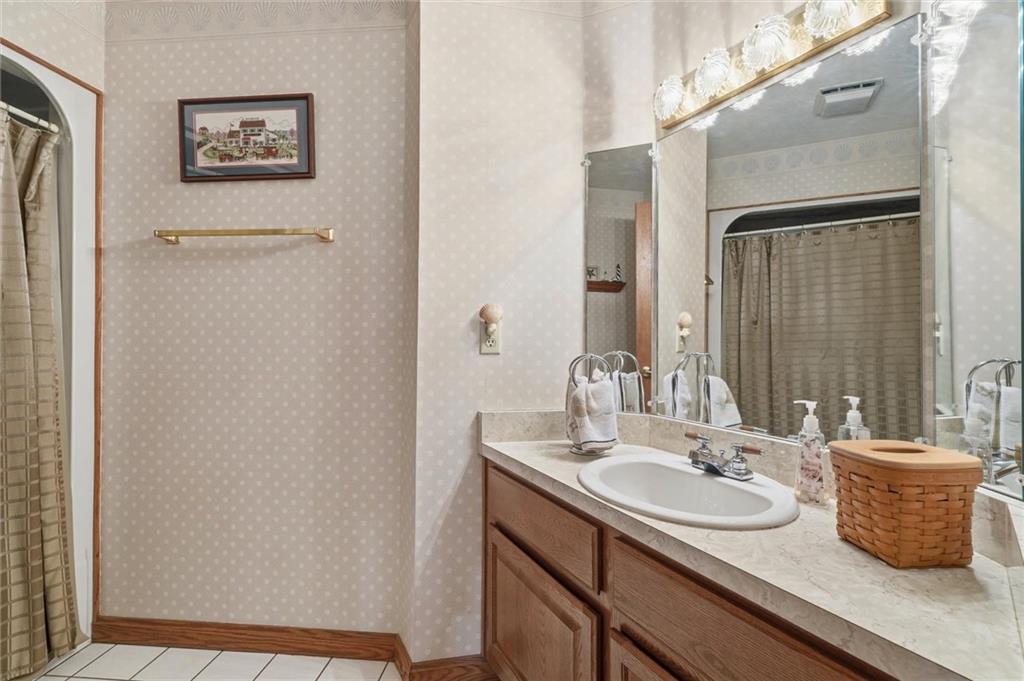 103 Seminole Trail Butler, PA 16001 - Photo 13 of 50 a bathroom with a sink and a mirror