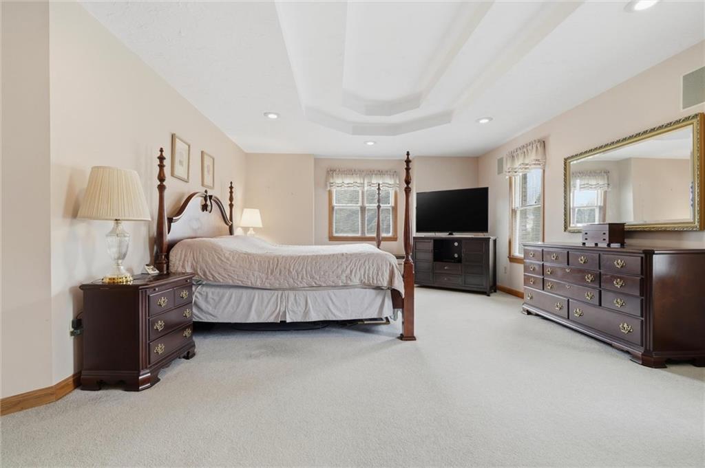 103 Seminole Trail Butler, PA 16001 - Photo 19 of 50 a spacious bedroom with a bed and tv