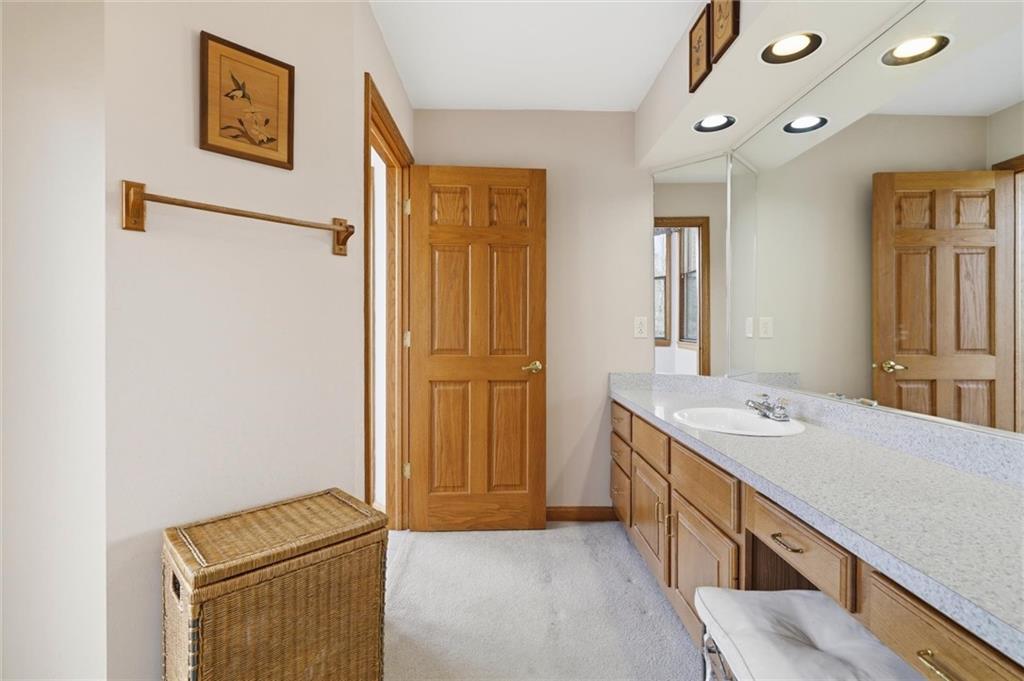 103 Seminole Trail Butler, PA 16001 - Photo 21 of 50 a hallway with sink a washer and dryer