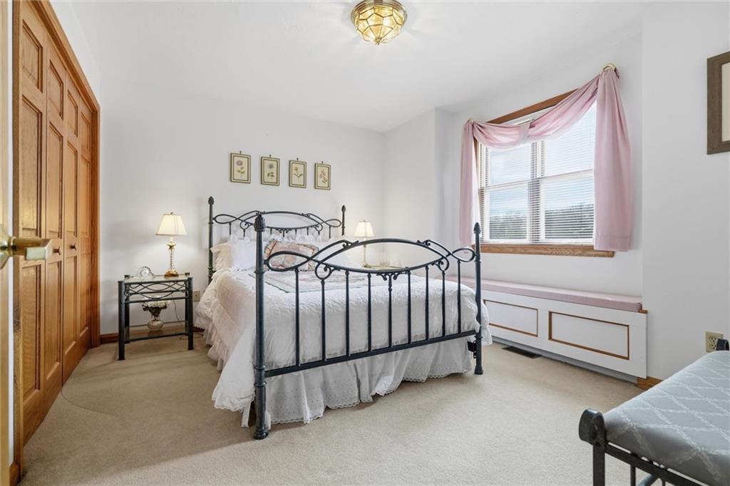 103 Seminole Trail Butler, PA 16001 - Photo 24 of 50 a bedroom with a bed and a window