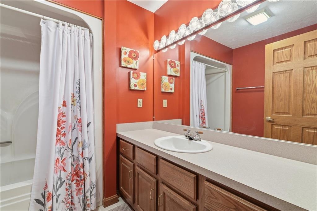 103 Seminole Trail Butler, PA 16001 - Photo 25 of 50 a bathroom with a sink and a mirror