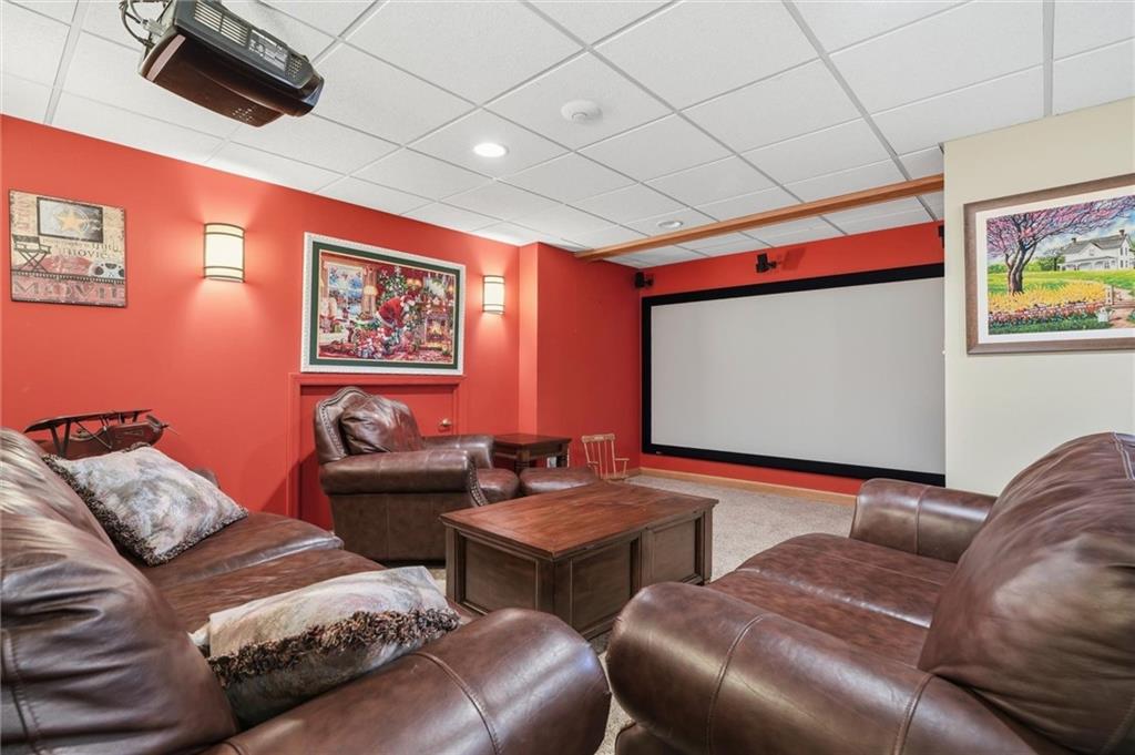 103 Seminole Trail Butler, PA 16001 - Photo 29 of 50 a projector room with a couch and a flat screen tv