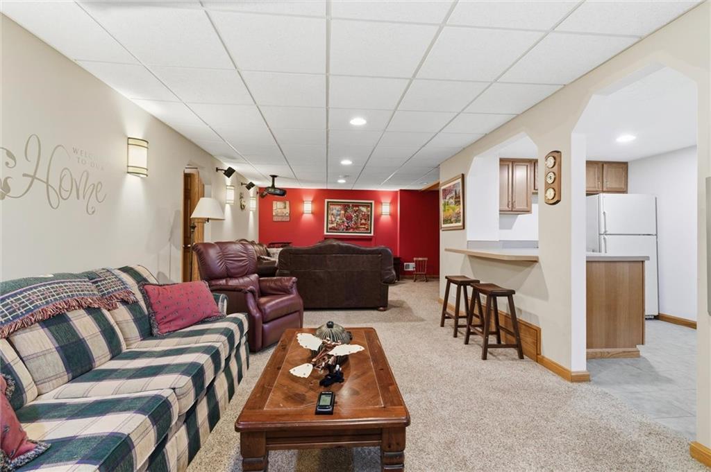 103 Seminole Trail Butler, PA 16001 - Photo 31 of 50 a living room with furniture a ceiling fan and a rug
