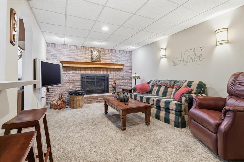 103 Seminole Trail Butler, PA 16001 - Photo 32 of 50 a living room with furniture and a fireplace
