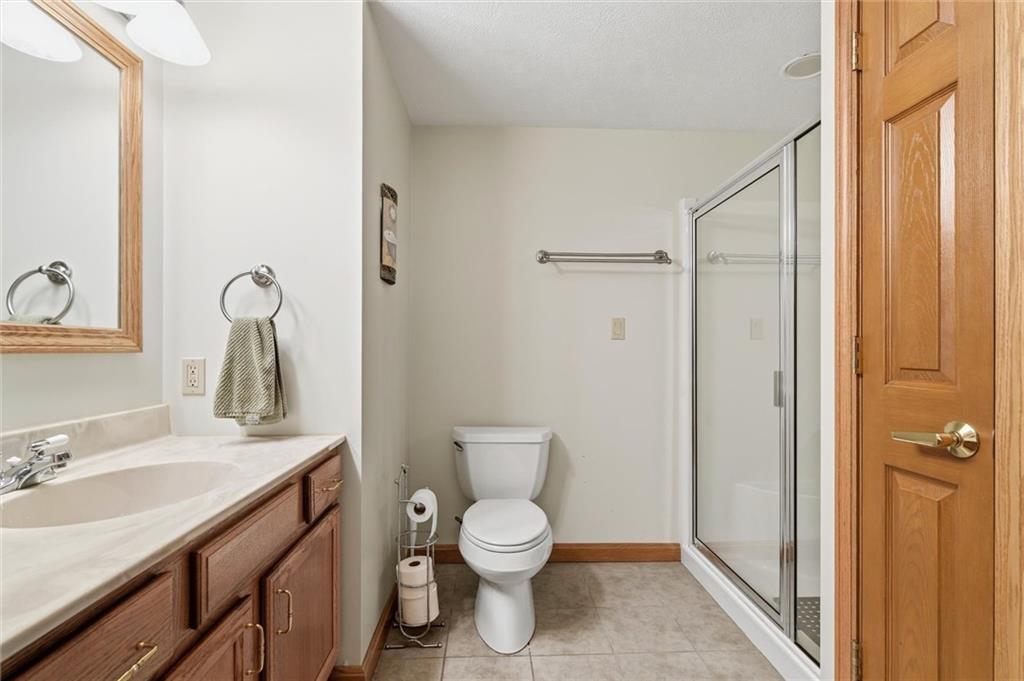 103 Seminole Trail Butler, PA 16001 - Photo 36 of 50 a bathroom with a toilet sink and shower