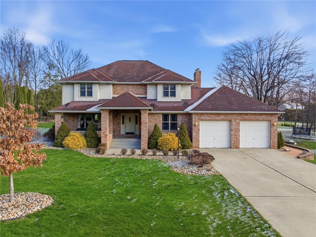 103 Seminole Trail Butler, PA 16001 - Photo 39 of 50 a front view of a house with a yard and porch