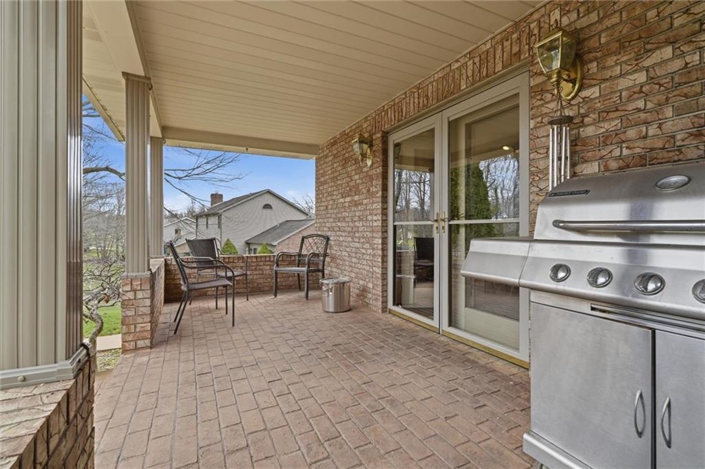 103 Seminole Trail Butler, PA 16001 - Photo 49 of 50 a view of a patio with table and chairs and potted plants