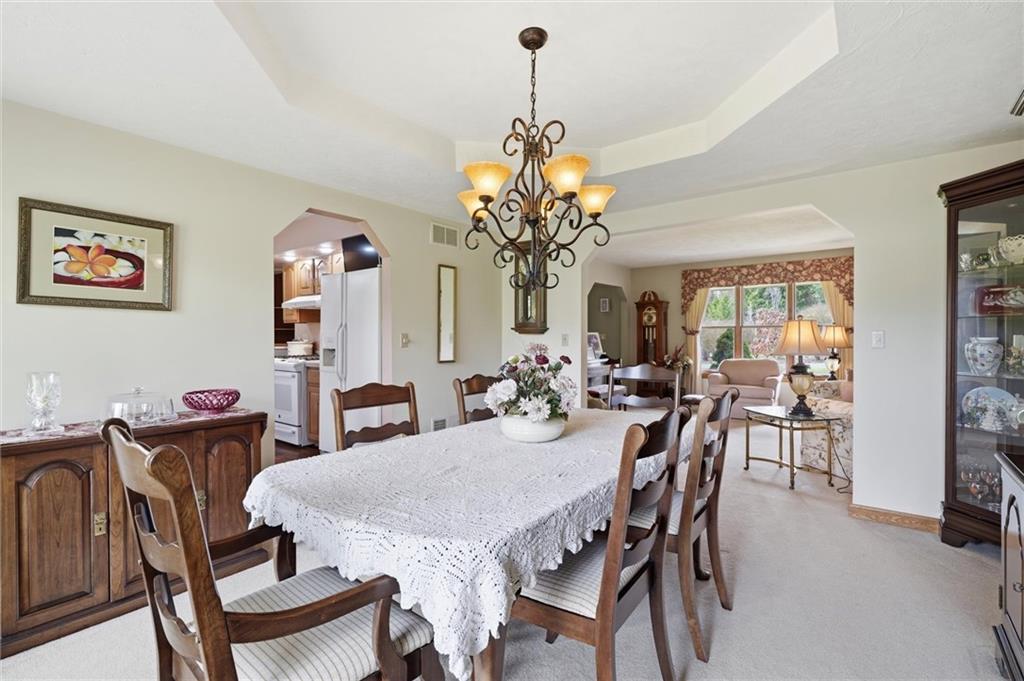 103 Seminole Trail Butler, PA 16001 - Photo 6 of 50 a view of a dining room with furniture and a chandelier