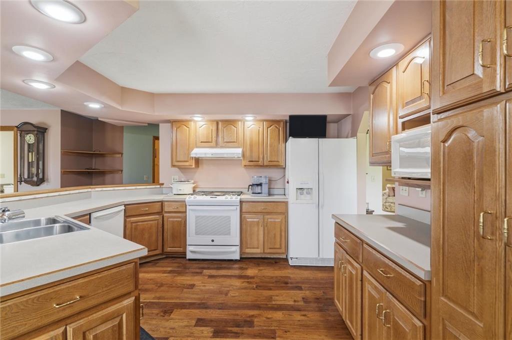 103 Seminole Trail Butler, PA 16001 - Photo 7 of 50 a kitchen with a sink stove and refrigerator