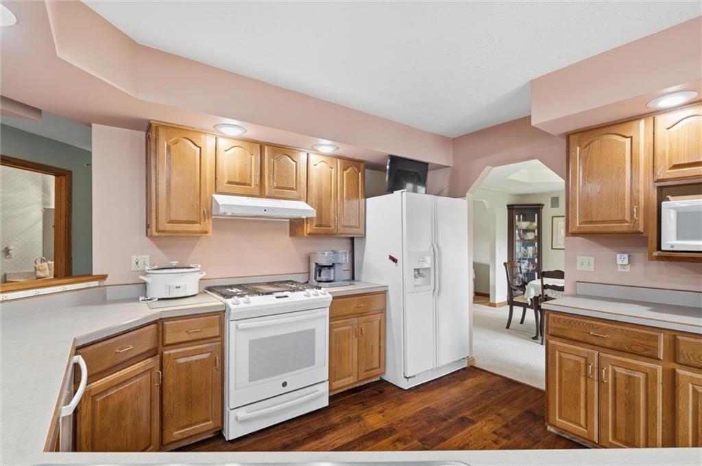 103 Seminole Trail Butler, PA 16001 - Photo 8 of 50 a kitchen with a sink a refrigerator and cabinets