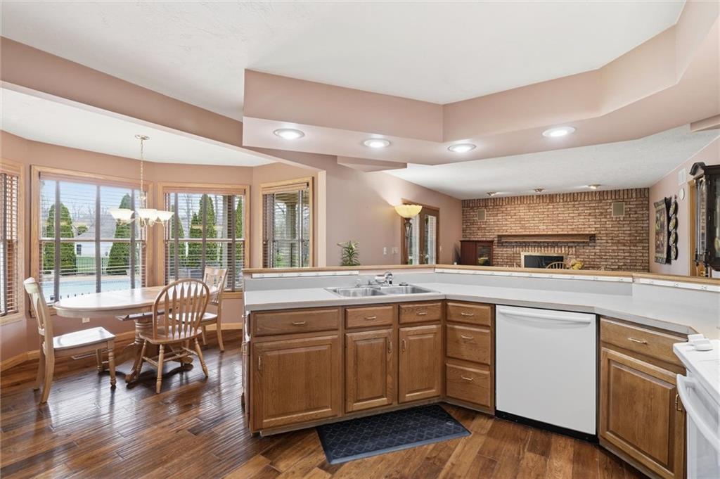103 Seminole Trail Butler, PA 16001 - Photo 9 of 50 a open kitchen with a sink and cabinets