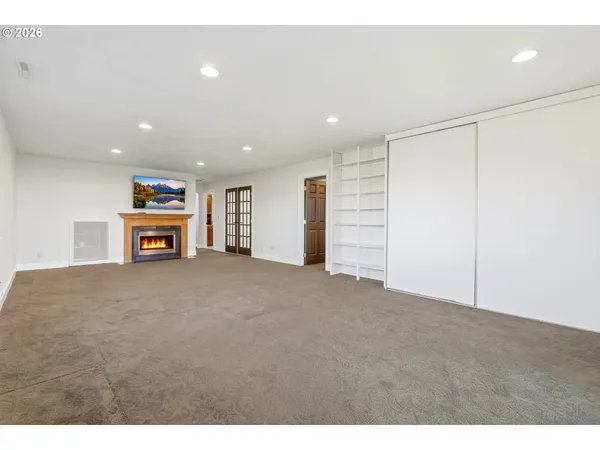 a view of an empty room with a window