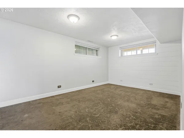 a bathroom with a sink a mirror and a shower
