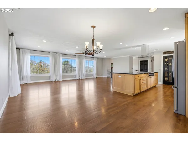 a view of a living room and a kitchen with a sink