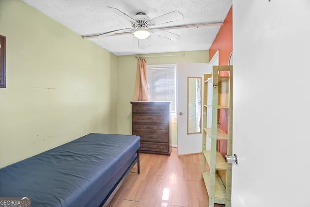 a view of hallway with bathroom