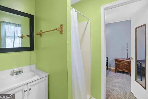 a kitchen with a sink cabinets and window
