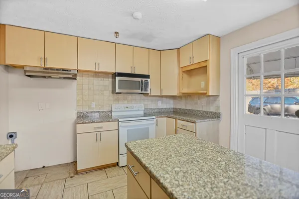 a front view of a house with wooden floor