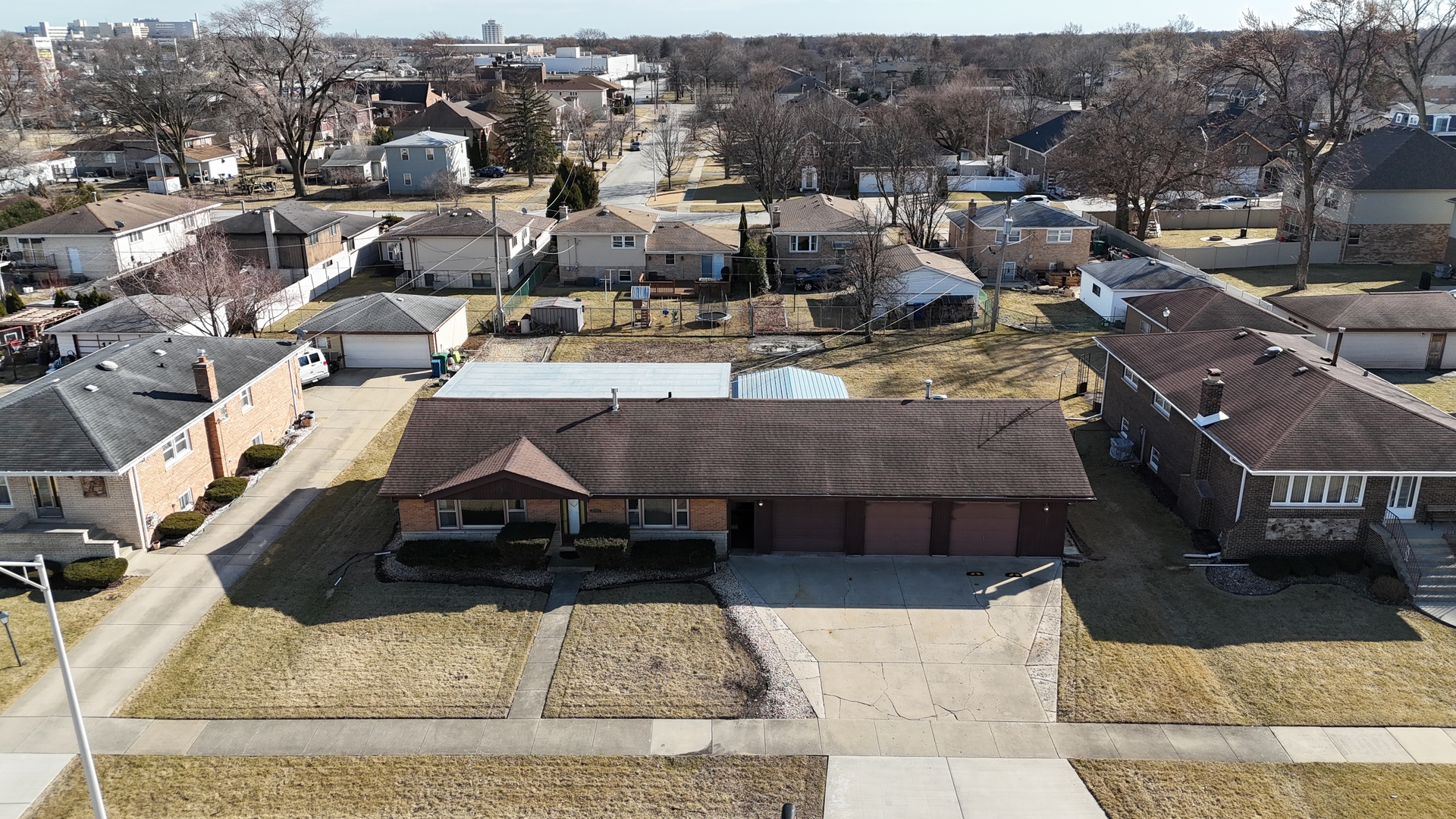 an aerial view of a house with swimming pool