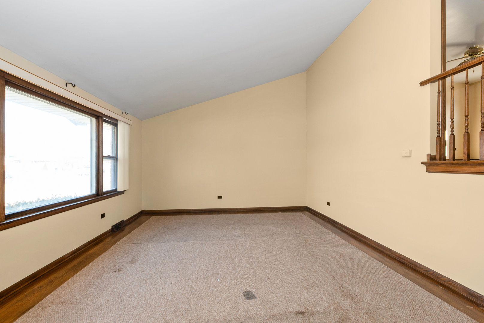 4937 West 85th Place Burbank, IL 60459 - Photo 11 of 32 a view of an empty room with a window