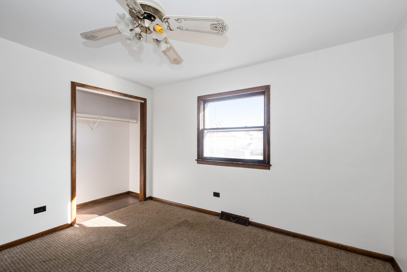 4937 West 85th Place Burbank, IL 60459 - Photo 13 of 32 an empty room with windows and fan