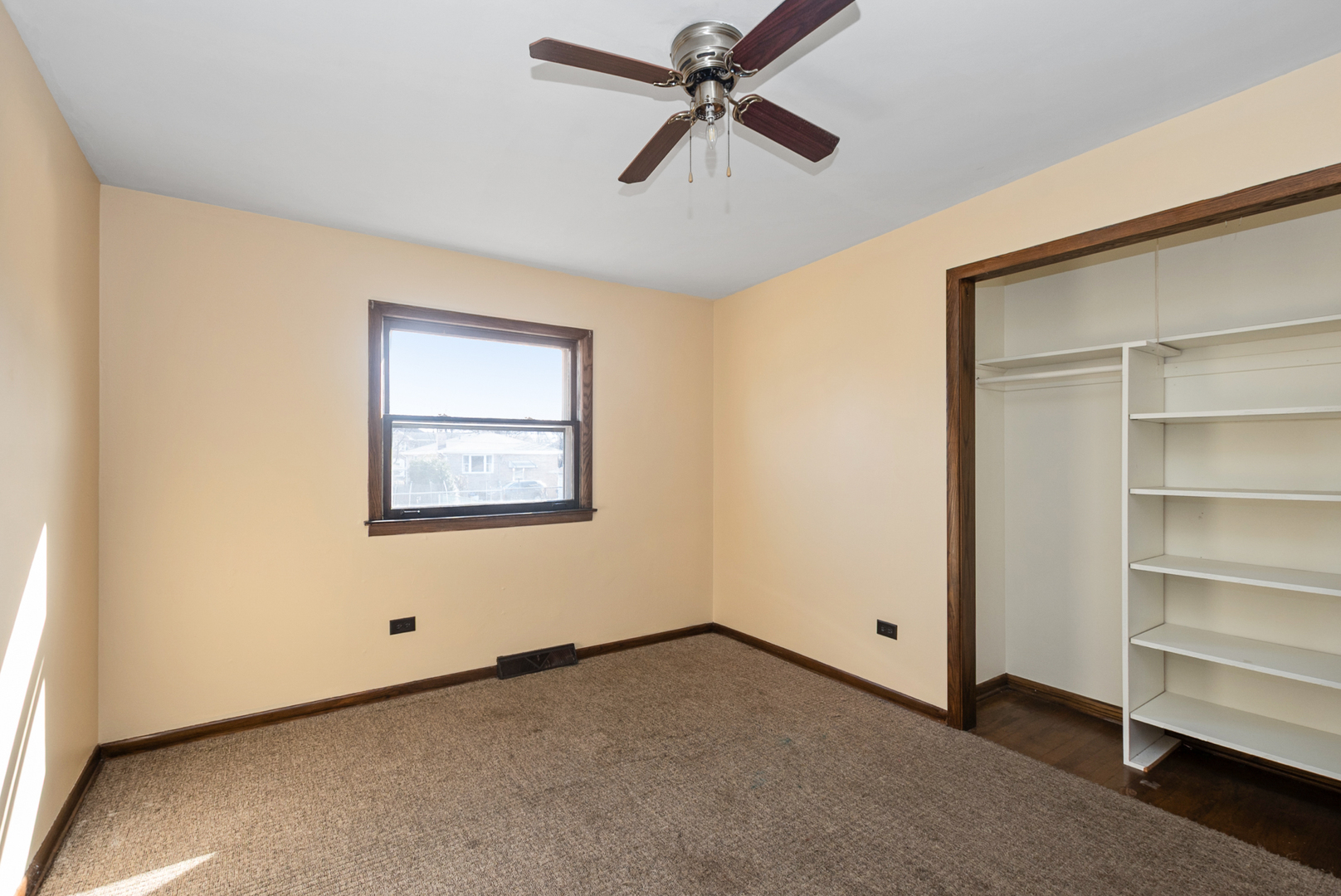 4937 West 85th Place Burbank, IL 60459 - Photo 14 of 32 a view of an empty room with a window