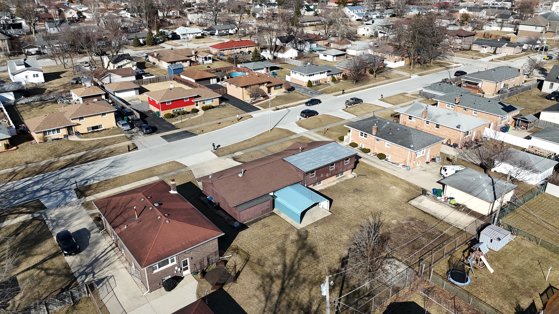 4937 West 85th Place Burbank, IL 60459 - Photo 27 of 32 an aerial view of a city with lots of residential buildings