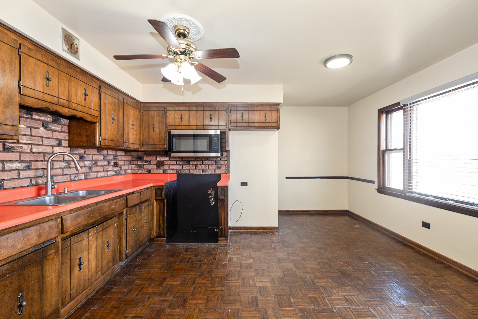4937 West 85th Place Burbank, IL 60459 - Photo 7 of 32 a kitchen with stainless steel appliances granite countertop a sink a stove and a refrigerator