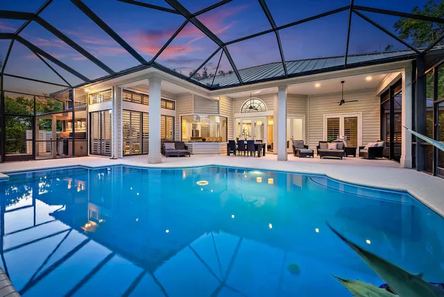 a view of a living room with furniture and kitchen view