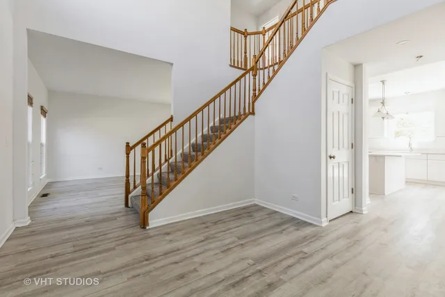 a view of staircase with wooden floor and stairs
