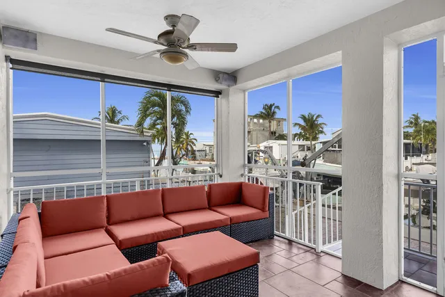 a work room with furniture and a potted plant