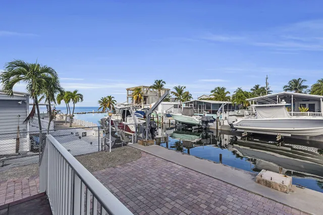 a view of a balcony with chairs