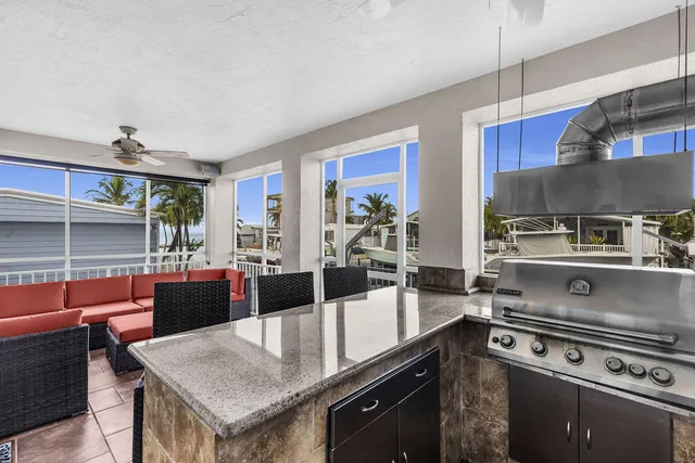 a kitchen with a stove a sink and a refrigerator